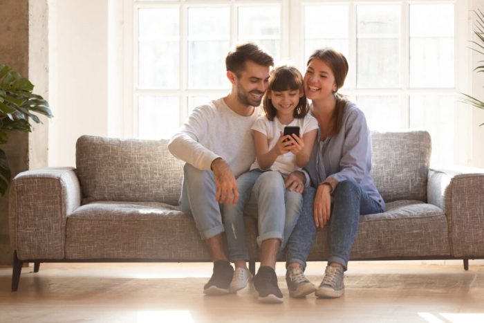 Family Using a Cell Phone 1024x683